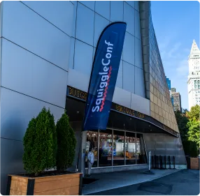 SquiggleConf signage outside the theater on a sunny day